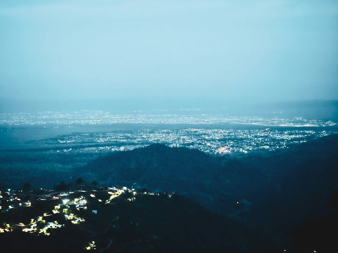 Hillside city seen from above at dusk