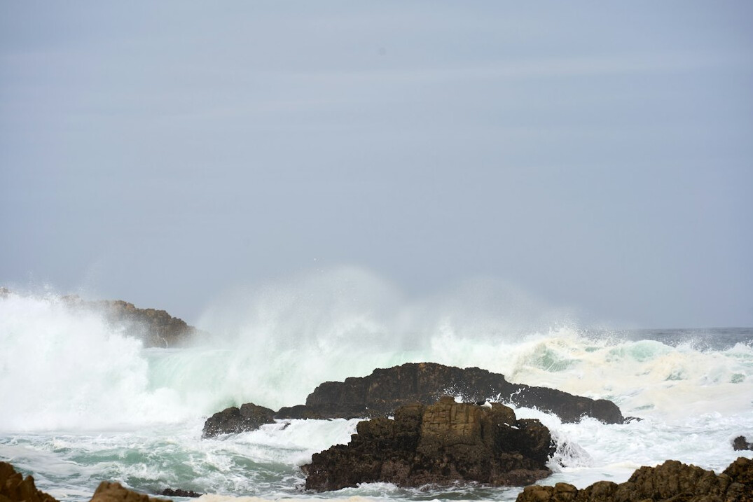 Stormy sea crashing against a rocky coast