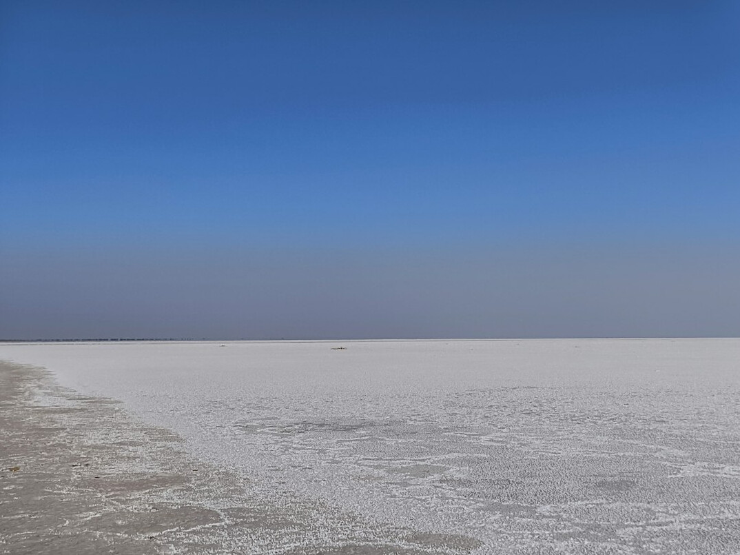 White salt flat stretching to the horizon
